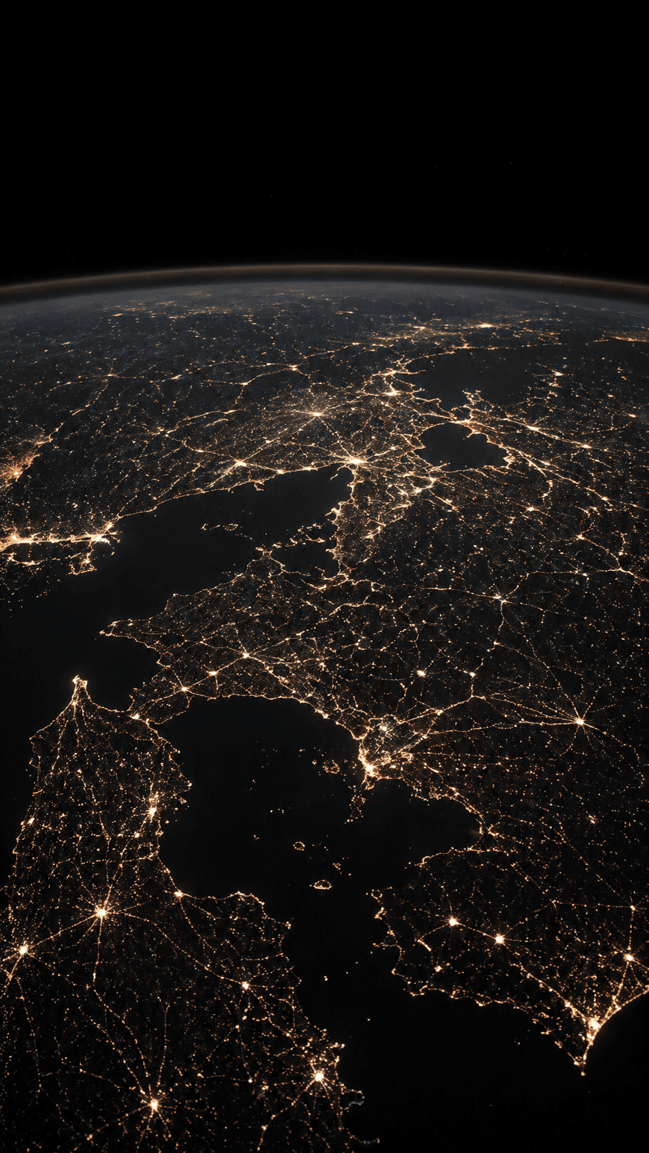 Earth at night, illuminated by a planetary network of city lights